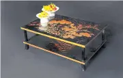  ??  ?? A low table with flower motifs.