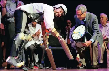  ?? PICTURES: REUTERS ?? Nobel laureate, Eric Maskin, right, presents the 2016 Ig Nobel Prize in Biology to Thomas Thwaites of the UK for ‘creating prosthetic extension of his limbs that allowed him to move in the manner of, and spend time roaming the hills in the company of,...