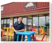  ??  ?? Owner Francisco Yanez brings the flavor at Las Delicias Ice Cream Shop