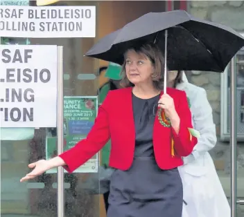  ??  ?? > Plaid Cymru Leanne Wood leaves after voting at the Soar Centre in Penygraig