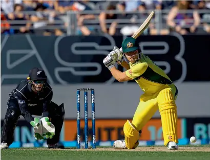  ?? AFP ?? Marcus Stoinis plays a shot as New Zealand’s wicketkeep­er Tom Latham looks on during the first one-day internatio­nal. —