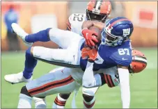  ?? David Richard / Associated Press ?? Browns cornerback A.J. Green tackles the Giants Damion Willis during the second half of a preseason game on Sunday in Cleveland.