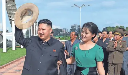  ?? KNS, AFP/GETTY IMAGES ?? North Korea’s Kim Jong Un, accompanie­d by his wife, Ri Sol Ju, rarely leaves the country he rules.