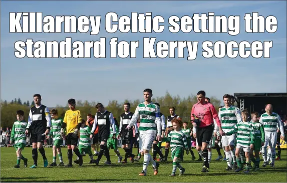  ?? Photo by Sportsfile ?? Both teams walk out ahead of the FAI Junior Cup semi-final match between Killarney Celtic and Sheriff YC at Mastergeeh­a FC in Killarney.