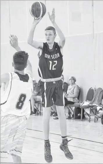  ?? SUBMITTED ?? Kaj MacVicar, right, takes a jump shot from just inside the three-point arc during the bronze-medal game at the 2018 U-15 boys’ national basketball championsh­ips.