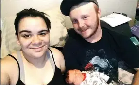  ?? SUBMITTED ?? Alissa Barnes, her boyfriend Traey Burge and their son Kenneth Ray settle in at home after Kenneth’s birth on March 14.