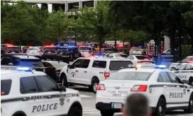  ?? ?? Emergency personnel at the scene of the shooting in Tulsa. Photograph: Michael Noble Jr./ Reuters