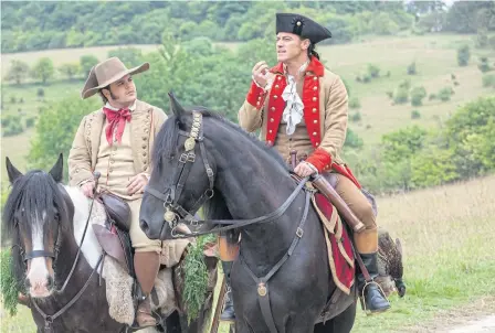  ??  ?? Josh Gad, left, and Luke Evans in a scene from Beauty And The Beast.