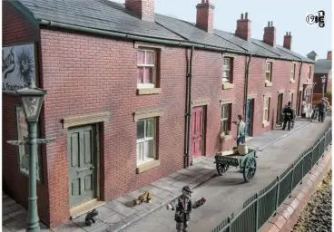  ??  ?? Below: The row of cottages, all kept in good order by the occupants with the corner shop keeping them well supplied. The postman (extreme right) has a natter with a resident while he’s doing his rounds.