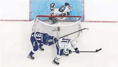  ?? MIKE CARLSON NHLI VIA GETTY IMAGES ?? Lightning captain Steven Stamkos chases Leafs captain John Tavares during the third period of Game 6 at Amalie Arena. With the loss, it’s the eighth time Toronto has had a team on the ropes since 2018 and failed to put that team away.