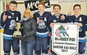  ?? ERIC MCCARTHY/TC MEDIA ?? Sandra Jamieson, co-ordinator of the P.E.I. Bantam AAA Hockey League, presents the league’s championsh­ip trophy and banner to the captains of the Eastern Express. From left are Cole Larkin, Jamieson, Isaac Wilson, Riley MacDougall and Reid Peardon. The...