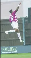  ??  ?? HIGH FLYER: Barnet’s Josh Clarke celebrates his strike