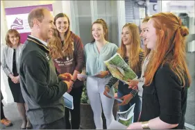  ?? Photograph­s by Anthony MacMillan Photograph­y. ?? Lochaber High School pupils on the Duke of Edinburgh Award scheme show the Earl pictures of their expedition canoeing on Loch Arkaig.