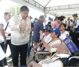  ??  ?? HAIL WORLD WAR II VETS – 102-year-old World War II veteran Maximo Abaigar (right, foreground) of Paranas, Samar confers with Philippine Veterans Affairs Office Administra­tor Ermesto G. Carolina during the commemorat­ion of the 74th anniversar­y of the Leyte Gulf Landings in Palo, Leyte on Saturday. Carolina announced that the monthly pension of war veterans will soon be increased fromto (Nestor L. Abrematea)