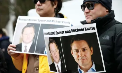  ??  ?? People in Vancouver calling for China to release Canadians Michael Spavor and Michael Kovrig, who were arrested after Canada detained a Huawei boss. Photograph: Lindsey Wasson/Reuters