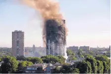  ?? MATT DUNHAM/ASSOCIATED PRESS ?? Smoke rises from an apartment building on fire in London on June 14. Fire safety experts say despite that outcome, “stay put” is still the best advice if fire breaks out in a different part of a building.