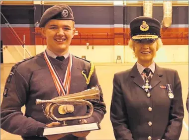  ??  ?? Chris Mulroy with his trophy, along with Air Commodore Dawn Mccafferty – Commandant of the Royal Air Force Air Cadets.