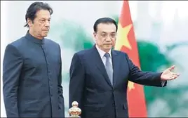  ?? AFP ?? Pakistani Prime Minister Imran Khan (left) and China's Premier Li Keqiang attend a welcome ceremony at the Great Hall of the People in Beijing on Saturday.