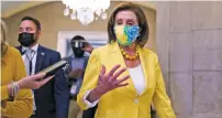  ?? SARAHBETH MANEY/NEW YORK TIMES ?? House Speaker Nancy Pelosi at the Capitol on Tuesday. Democrats overcame sharp internal rifts to advance a critical piece of President Biden’s domestic agenda.