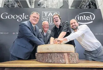  ?? AFP ?? From left to right, Tag Heuer director-general Guy Semon, Tag Heuer CEO Jean-Claude Biver, Intel Corp’s new devices general manager Michael Bell and Google Inc’s engineerin­g director for Androidwea­r David Singleton pose with a Swiss cheese during the...