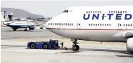  ?? AP ?? This February 23, 2011 file photo shows United Airlines planes taxing at San Francisco Internatio­nal Airport in San Francisco.