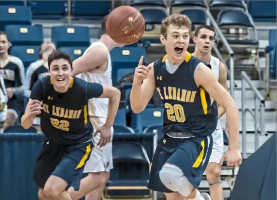  ?? Alexandra Wimley/Post-Gazette ?? Mt. Lebanon’s Sean Loughran, left, and Mike Palmer react as time runs out on their 62-57 WPIAL Class 6A championsh­ip victory against Butler Saturday night at Petersen Events Center.