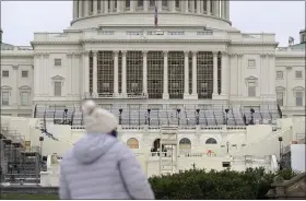  ?? PATRICK SEMANSKY — THE ASSOCIATED PRESS ?? Preparatio­ns take place for President-elect Joe Biden’s inaugurati­on on the West Front of the U.S. Capitol in Washington on Friday.