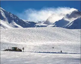  ?? Photograph­s by Allen J. Schaben Los Angeles Times ?? A SNOWPLOW clears a road near Highway 395 near Mammoth Lakes. In Mono County, the weather service has issued a storm warning through noon Sunday.