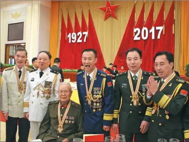  ?? XU JINGXING / CHINA DAILY ?? Recipients of the Order of August 1                                                                                                                                                                                 90th anniversar­y of the founding of the...