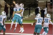  ?? VASHA HUNT — THE ASSOCIATED PRESS ?? Coastal Carolina wide receiver Jaivon Heiligh (6) and teammate Will McDonald (66) celebrate Heiligh’s touchdown against Troy during the second half of an NCAA college football game, Saturday, Dec. 12, 2020, in Troy, Ala.