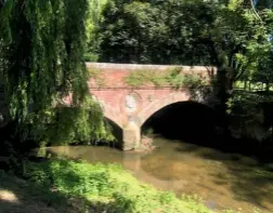  ??  ?? The Grade II listed Pentlow Bridge spans the gently flowing Stour, dappled by the shadows of leafy branches draping the banks.