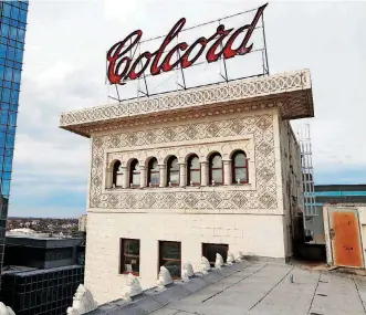  ??  ?? The iconic neon Colcord sign has stood perched above the rooftop penthouse at what is now the Colcord Hotel for more than a century.