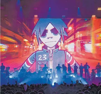  ?? FOTO: CHRISTOPHE GATEAU ?? Auch bei Live-Auftritten spielen die Cartoon-Figuren der Gorillaz eine scheinbar größere Rolle als die Musiker selbst. Wer die Band bei Rock im Park verpasst hat, kann sie im Juli beim Gurtenfest­ival oder im August beim FM4 Frequency Festival erleben.