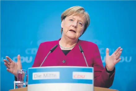  ?? Markus Schreiber, The Associated Press ?? “With this decision, I am trying to contribute to allowing the government to concentrat­e its strength, finally, on governing well,” German Chancellor Angela Merkel said at a news conference after a meeting in Berlin on Monday.