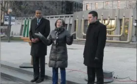  ??  ?? Montgomery County Commission­ers Ken Lawrence Jr. Valerie Arkoosh and Joseph Gale speak before the lighting of a tree, a menorah and a kinara at the county courthouse Dec. 5.