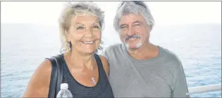  ?? JEREMY FRASER/CAPE BRETON POST ?? Tina Huszar (left) and her husband, Brian Store, stand on the deck of the MV Highlander­s during an Aug. 7 crossing between North Sydney and Port aux Basques. The couple was travelling to Newfoundla­nd on vacation to visit Huszar’s stepfather and sister.