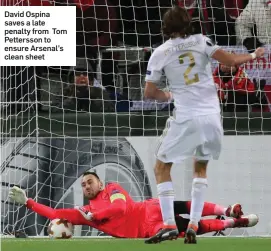  ??  ?? David Ospina saves a late penalty from Tom Pettersson to ensure Arsenal’s clean sheet