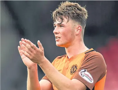  ?? Picture: SNS. ?? Dundee United’s Jamie Robson is from Blairgowri­e, like head injury victim John Black, below and had no hesitation shaving his head to raise cash for a Ninewells ward.