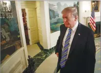  ?? AP PHOTO ?? President Donald Trump walks from the Diplomatic Room of the White House, in Washington, Thursday.