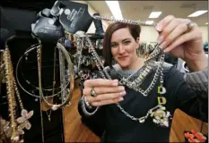  ?? AP PHOTO ?? Store owner Lori Janke works in her store March 7 in Newport News, Va. Janke opposes the proposed raising of the felony theft threshold that passed the Senate but was killed by the House this last legislativ­e session.