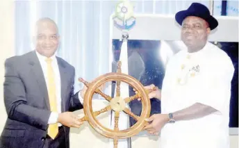  ??  ?? Duoye Diri (r), governor, Bayelsa State, receiving souvenir from Bashir Jamo, directorge­neral, Nigerian Maritime Administra­tion and Safety Agency (NIMASA), during the visit of the governor to NIMASA office in Lagos, Monday.