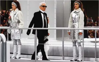  ??  ?? German fashion designer Karl Lagerfeld appears after Chanel's Fall-Winter 2017/2018 ready-to-wear fashion collection presented in Paris.