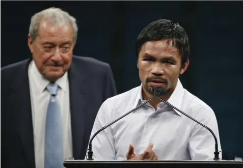  ?? AP FILE PHOTO ?? Top Rank Inc. bigboss Bob Arum is not sure if his prized ward Manny Pacquiao can still continue his boxing career while serving as a politician.