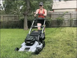  ?? Special to the Democrat-Gazette/JOHN PEDERSON ?? The author’s daughter, Paige Roth, test drives the next generation of lithium-battery-powered mowers, which are greener, cleaner and quieter.