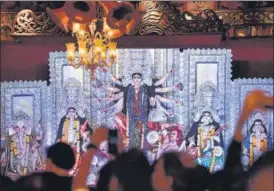  ?? HT ARCHIVE ?? Till Covid-19 struck in 2020, the five days of Durga Puja were marked by decorated streets, carnivals, pandal hopping and shopping