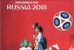  ?? ZHANG CHI / FOR CHINA DAILY ?? Posters pop up around China, like this one seen on Wednesday in Weifang, Shandong province, promoting the upcoming 2018 World Cup in Russia.