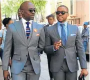  ?? Instagram ?? Questions: Finance Minister Malusi Gigaba, walks with his spokesman Mayihlome Tshwete in this file picture. /©