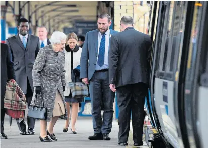  ??  ?? The Queen arrives at King’s Lynn station yesterday for her scheduled service back to London