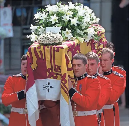  ?? PETER DEJONG, AP ?? Welsh Guards carry Diana’s casket, topped with the royal standard, out of Westminste­r Abbey after her funeral.