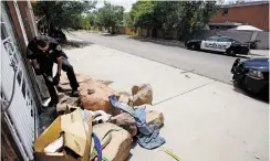  ?? PHOTOS BY LUIS SÁNCHEZ SATURNO THE NEW MEXICAN ?? LEFT: Dellalonga picks up discarded needles in the city’s Internatio­nal District on Friday.